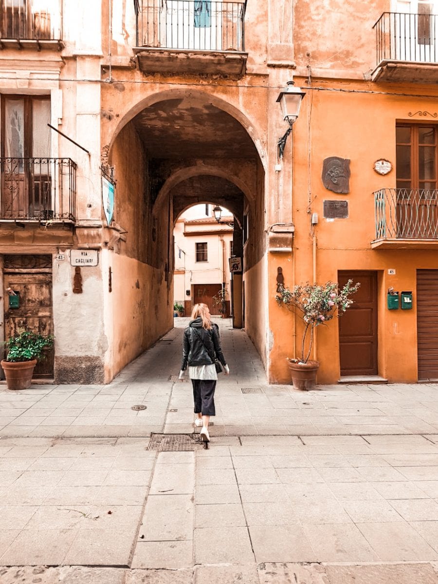 girl walking through typical italian city